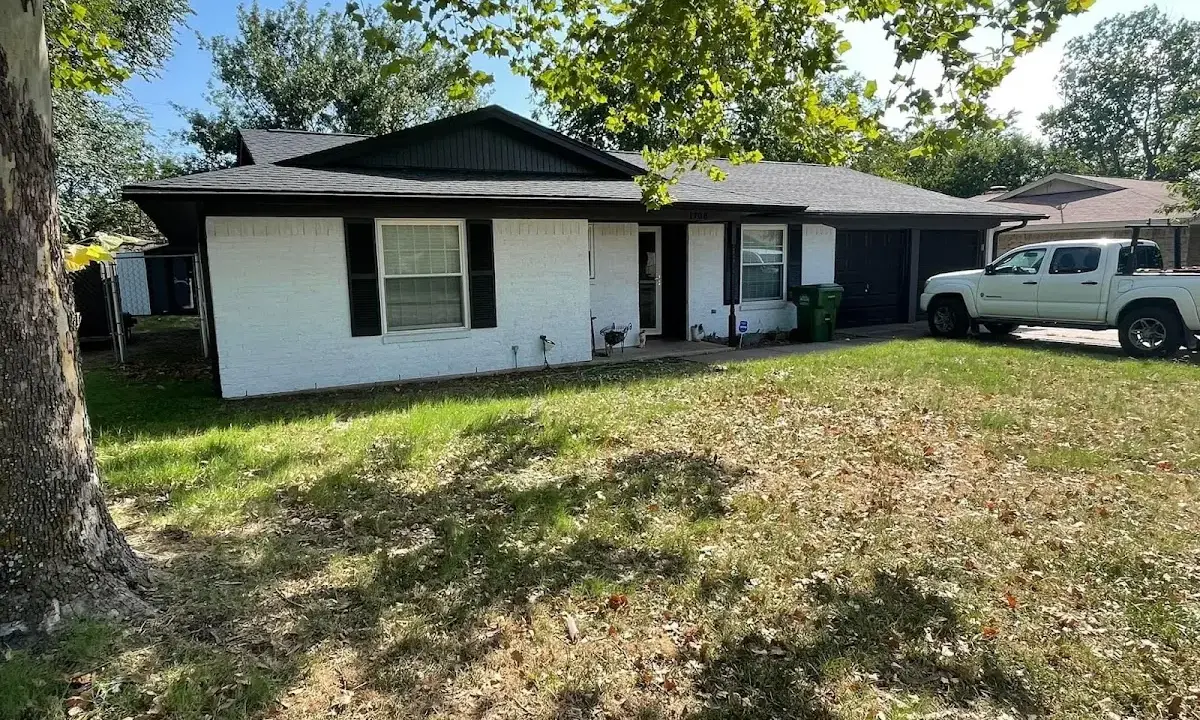 Professional roofing crew working on a residential roof in Tyngsborough